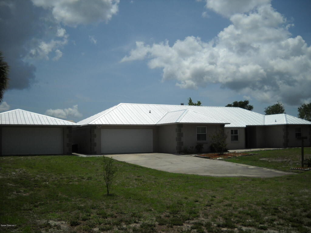 Property Photo:  5525 Fishtail Palm Avenue  FL 32927 