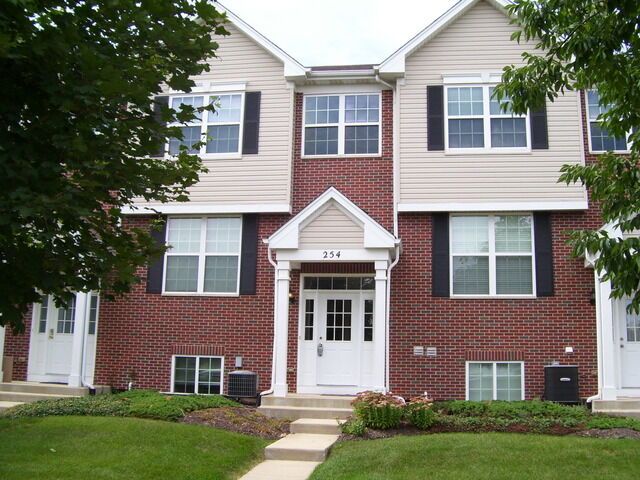 Property Photo: 254 S Alder Creek Drive 1802 IL 60446