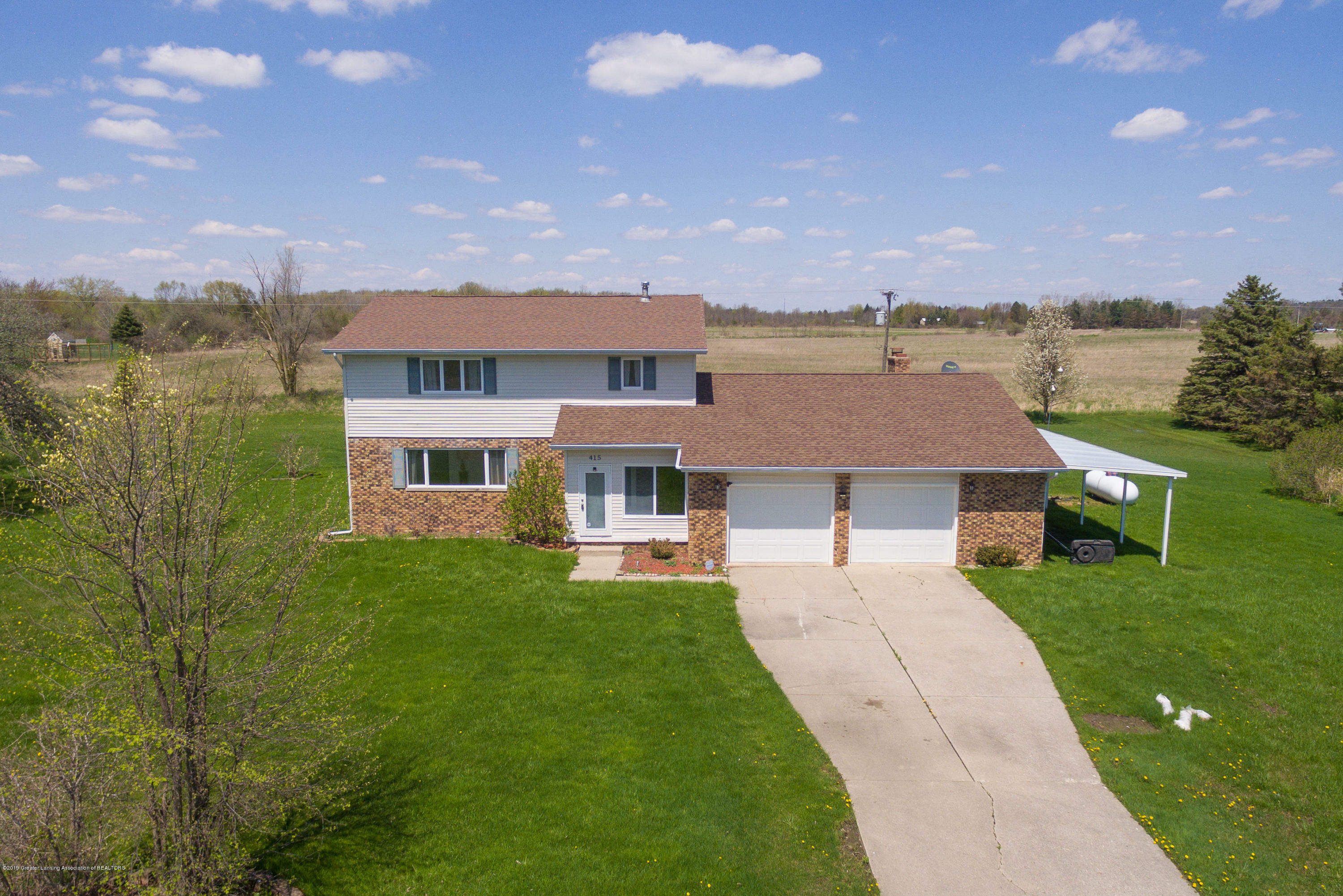 Property Photo:  415 E Holt Road  MI 48895 