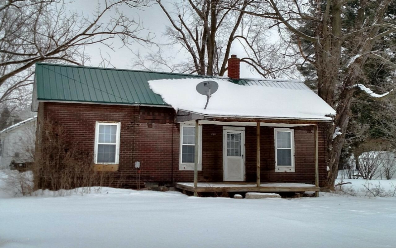 Property Photo:  418 W Fourth Street  MI 49631 