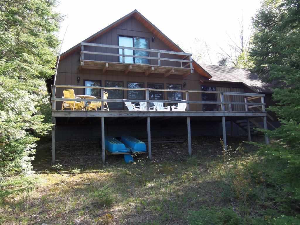 Property Photo:  07657 Nine Mile Point  MI 49720 