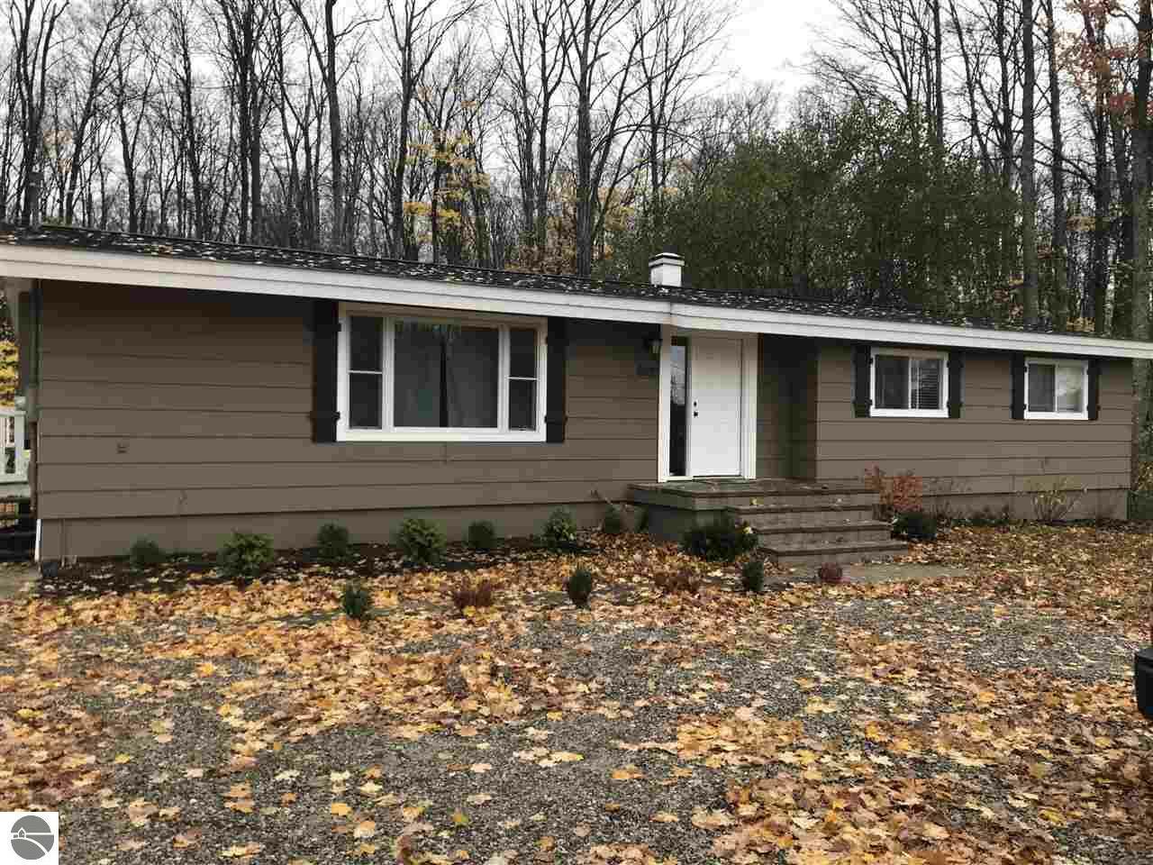 Property Photo:  8833 N Long Lake Road  MI 49685 