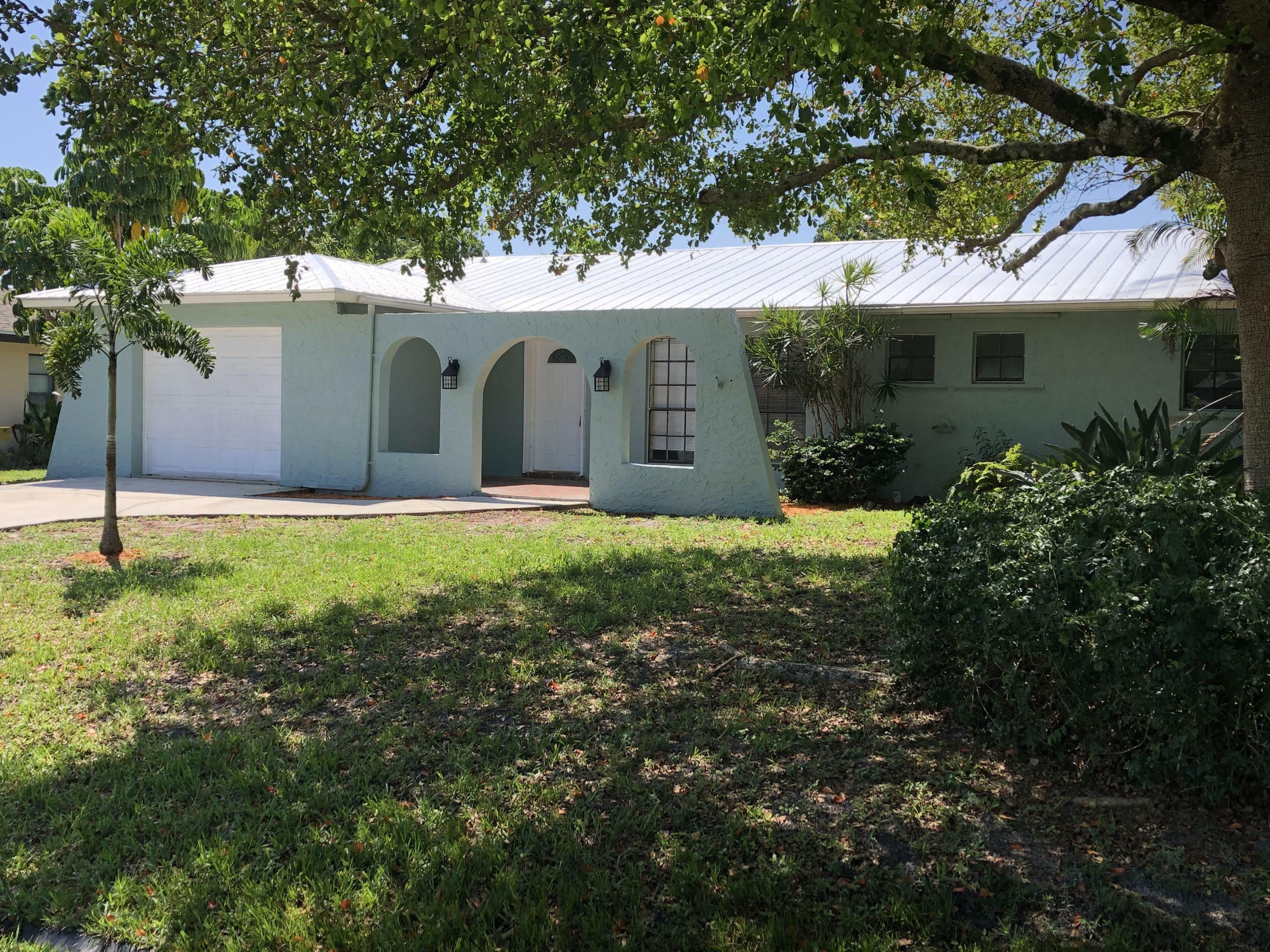 Property Photo:  312 SE Atlas Terrace  FL 34983 