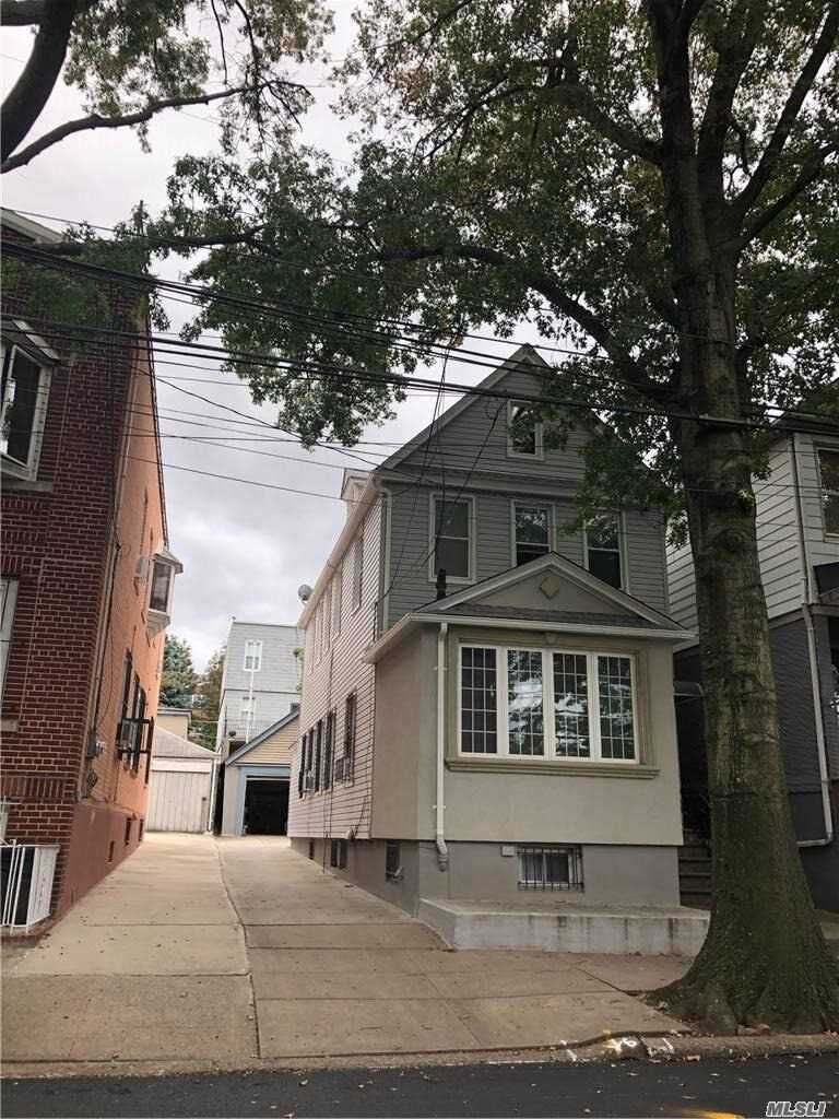 Property Photo:  67-08 51st Road  NY 11377 