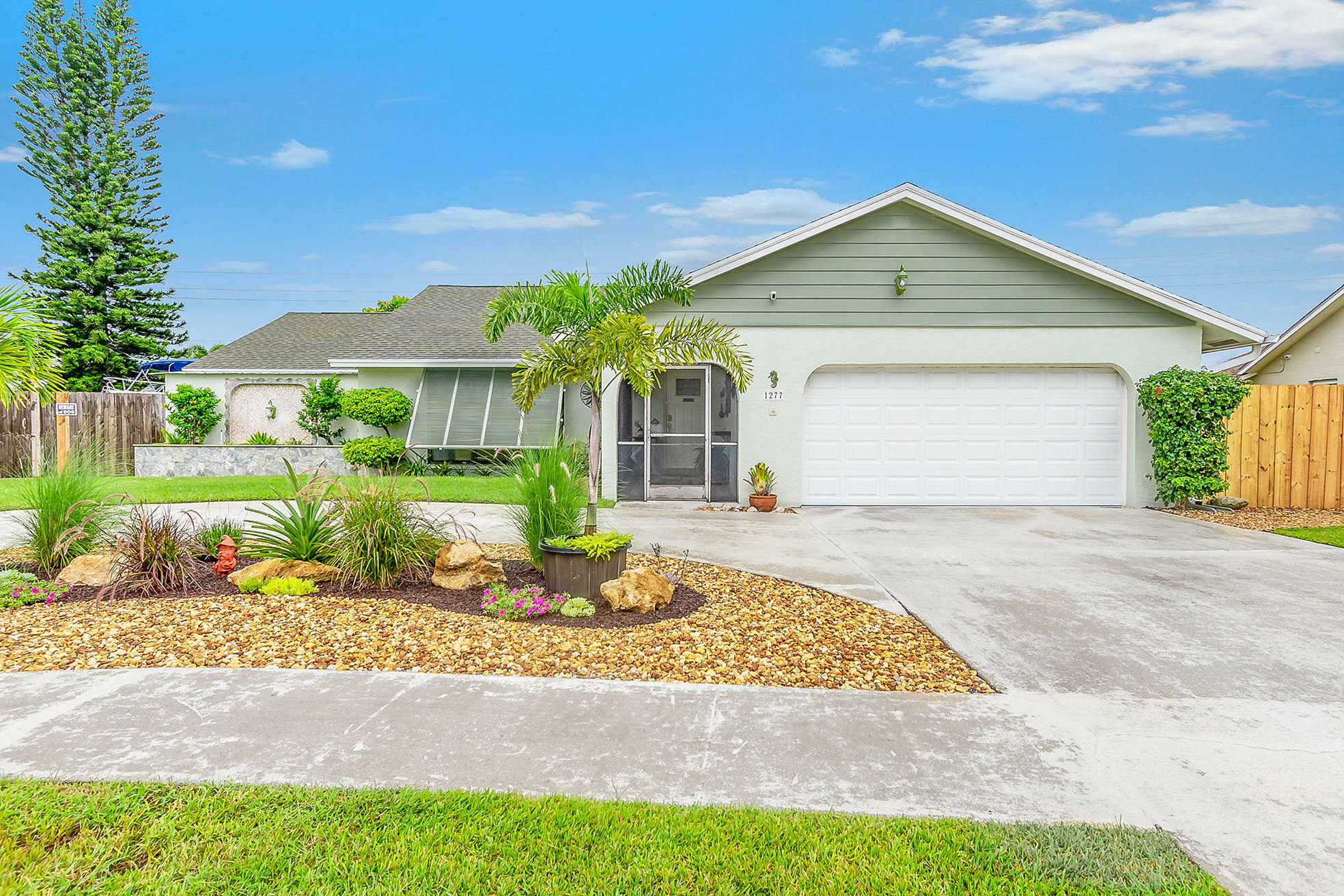 Property Photo:  1277 Jackpine Street  FL 33414 