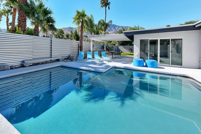 Property Photo:  1303 E Racquet Club Road  CA 92262 