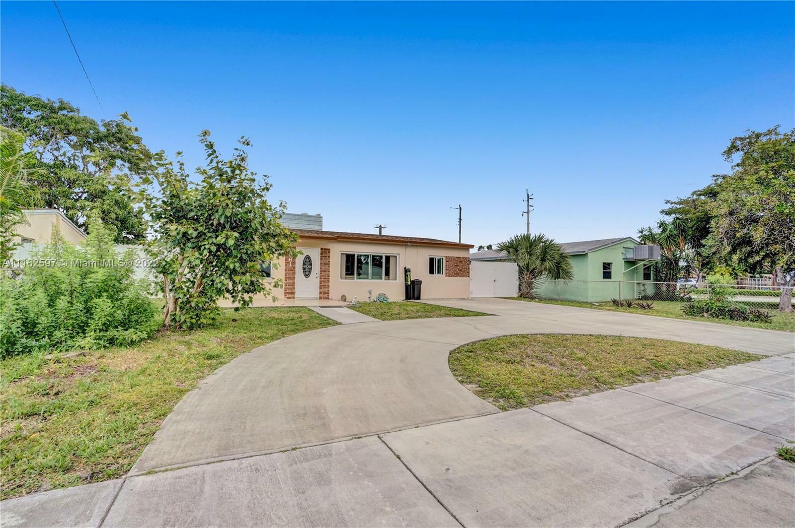 Property Photo:  561 NE 61st St  FL 33334 