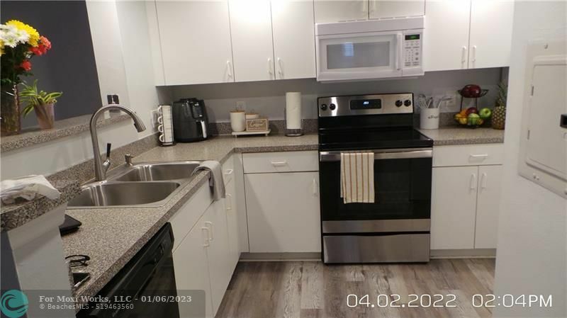 Property Photo:  5001 Wiles Rd 106  FL 33073 