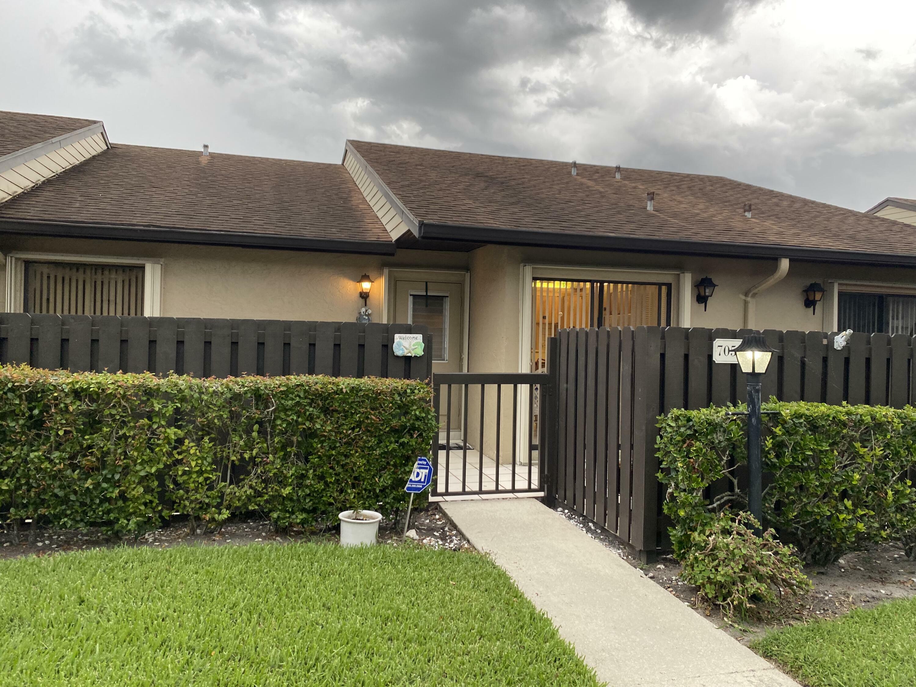 Property Photo:  705 Sunny Pine Way E  FL 33415 