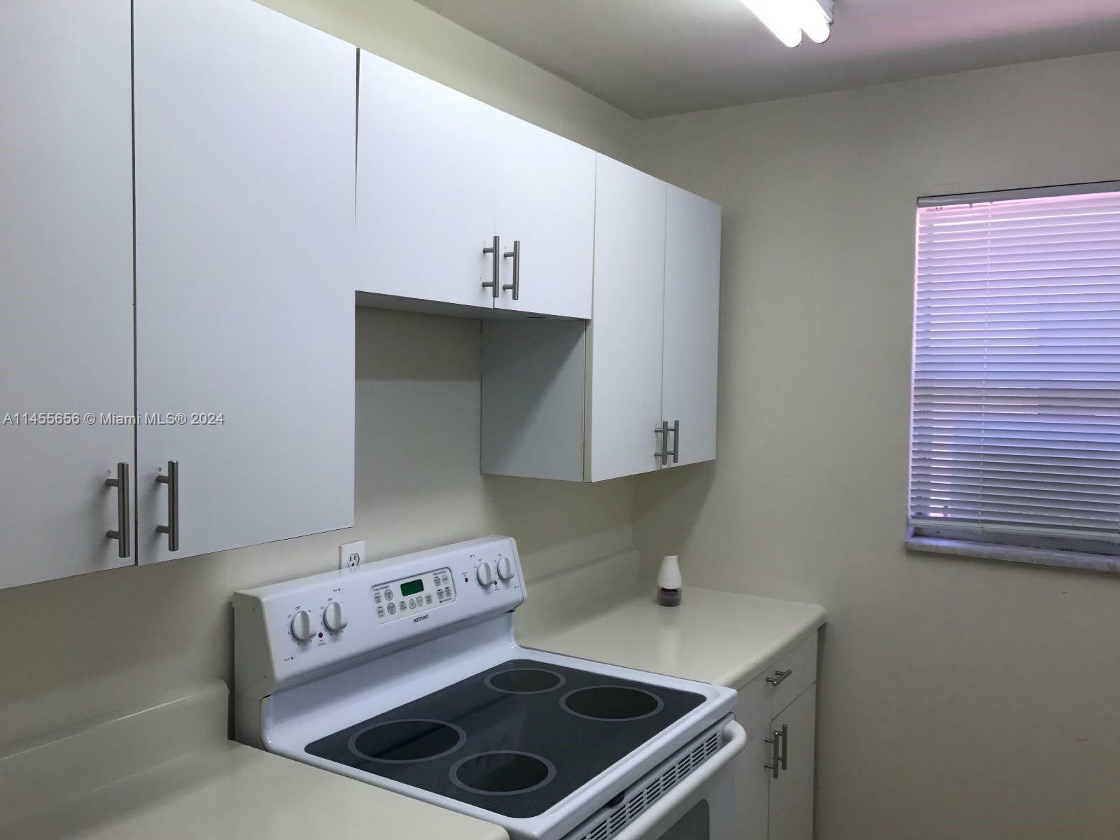 Property Photo:  450 SW 2nd Ave 2040  FL 33432 