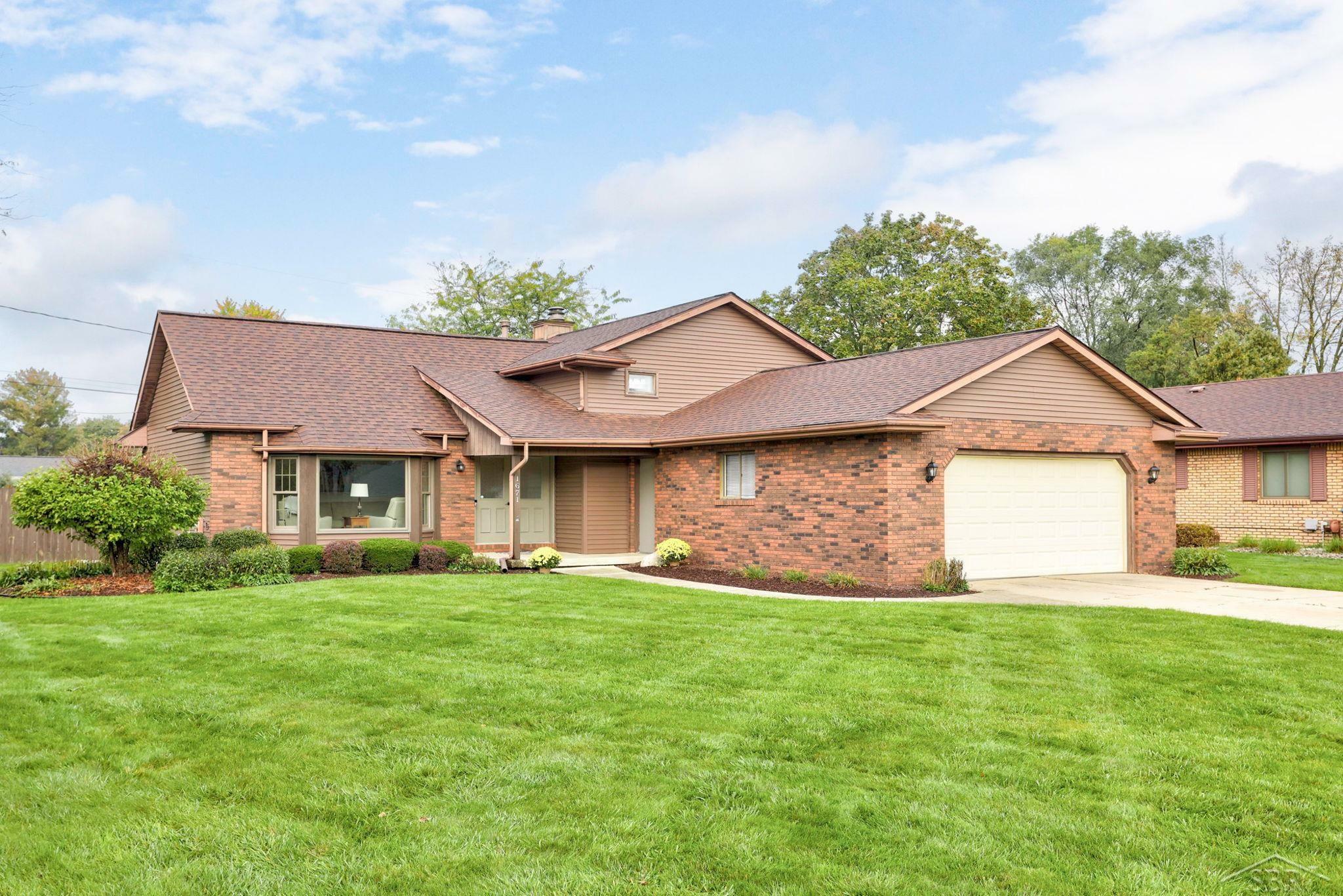 Property Photo:  1671 Cranbrook  MI 48638 