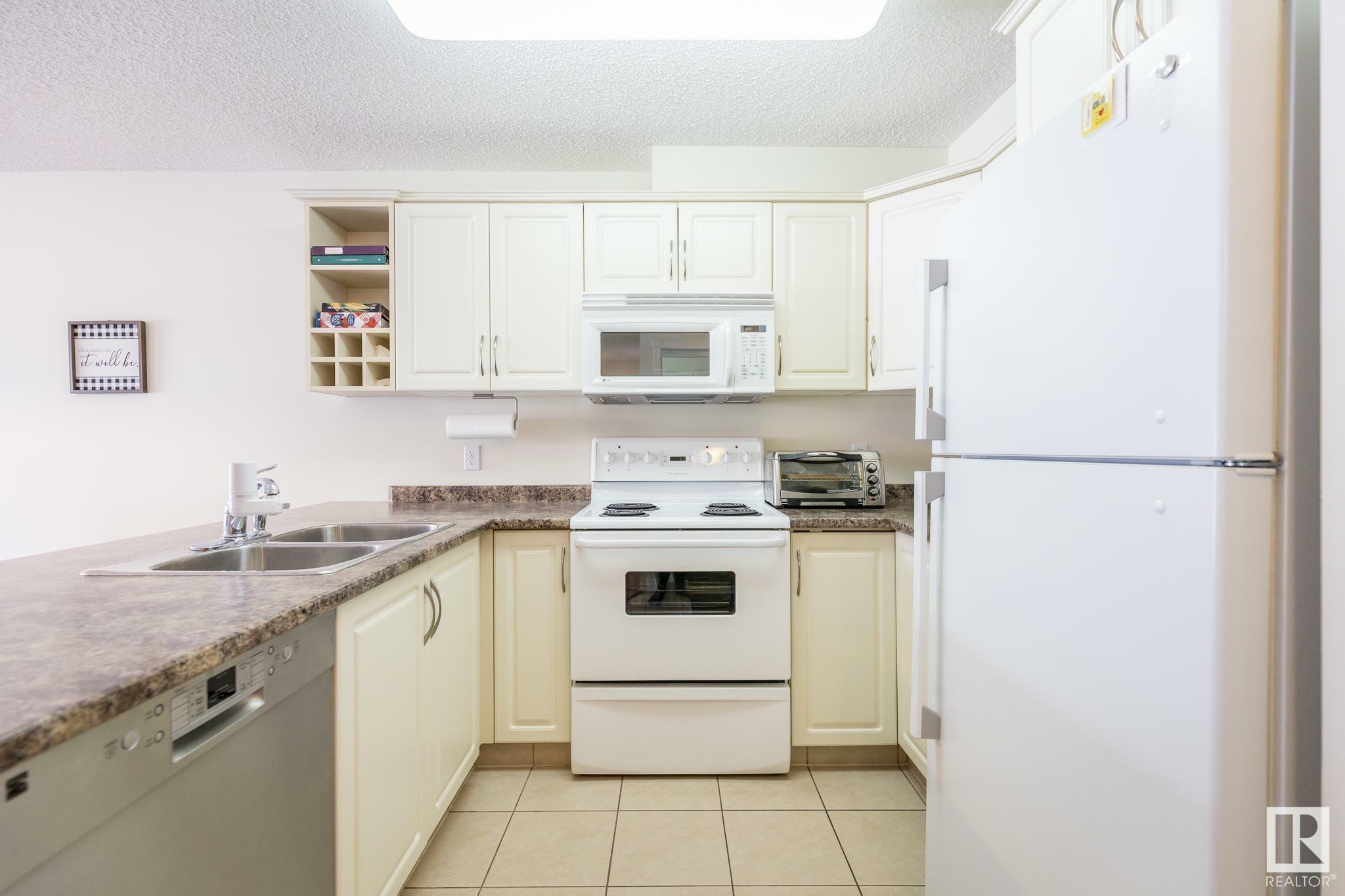 Property Photo:  17404 64 Avenue NW 221  AB T5T 6X4 