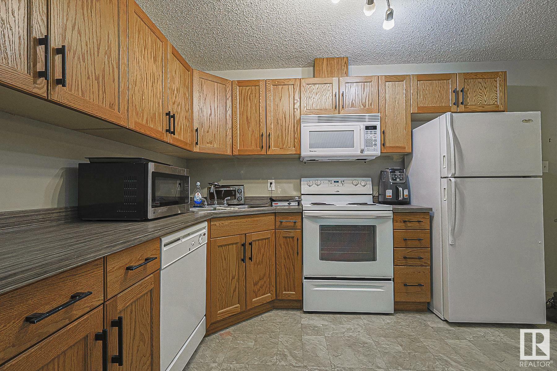 Property Photo:  309 Clareview Station Drive NW 119  AB T5Y 0C5 