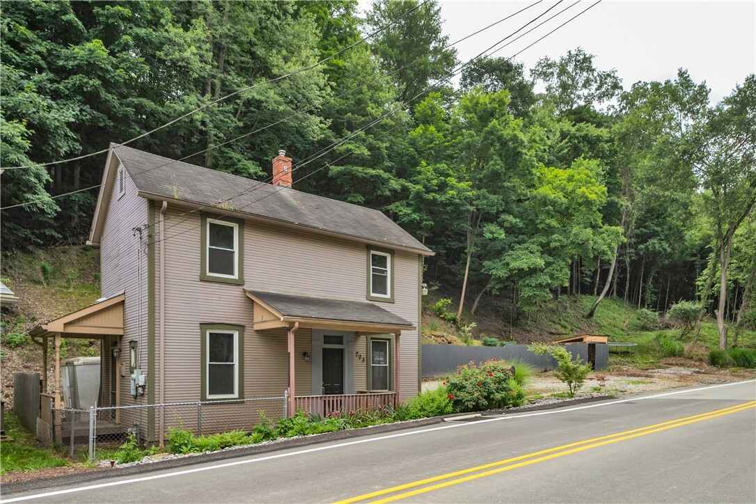 Property Photo:  203 Coal Valley Rd  PA 15025 