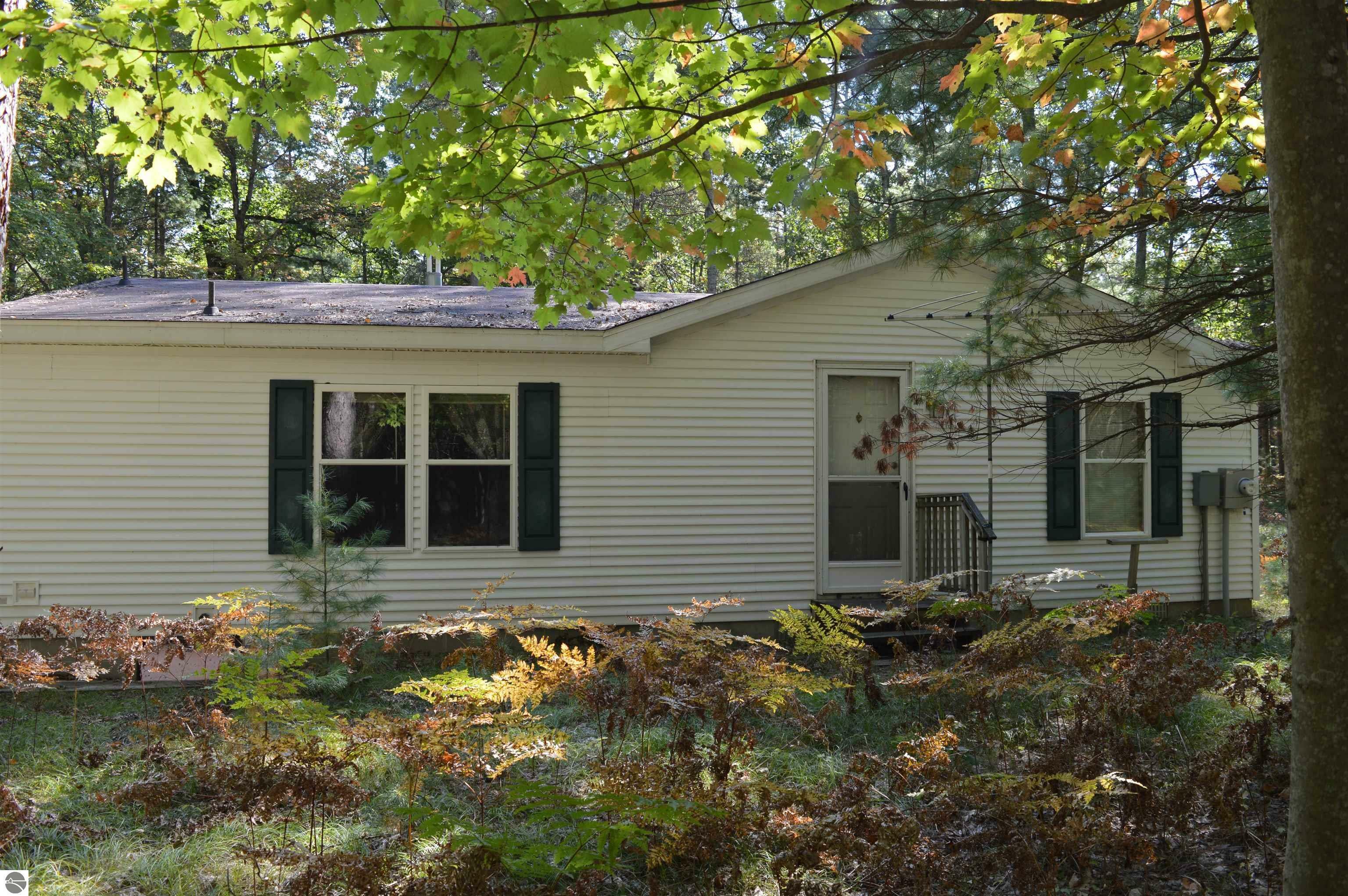 Property Photo:  6188 SW Jesses Trail  MI 49680 