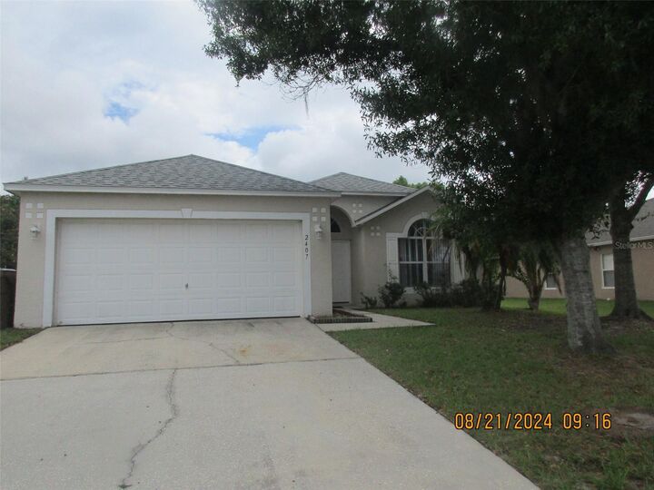Property Photo: 2407 Marcasite Loop FL 34743