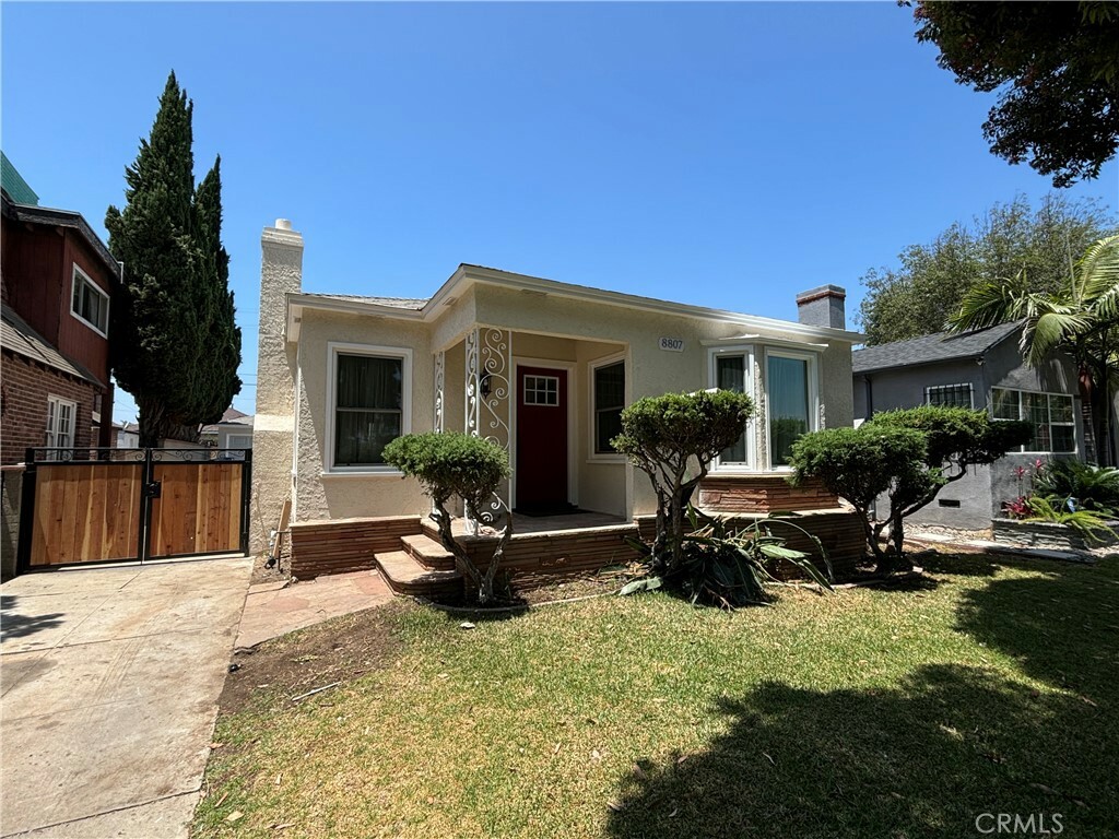 Property Photo:  8807 Cimarron Street  CA 90047 