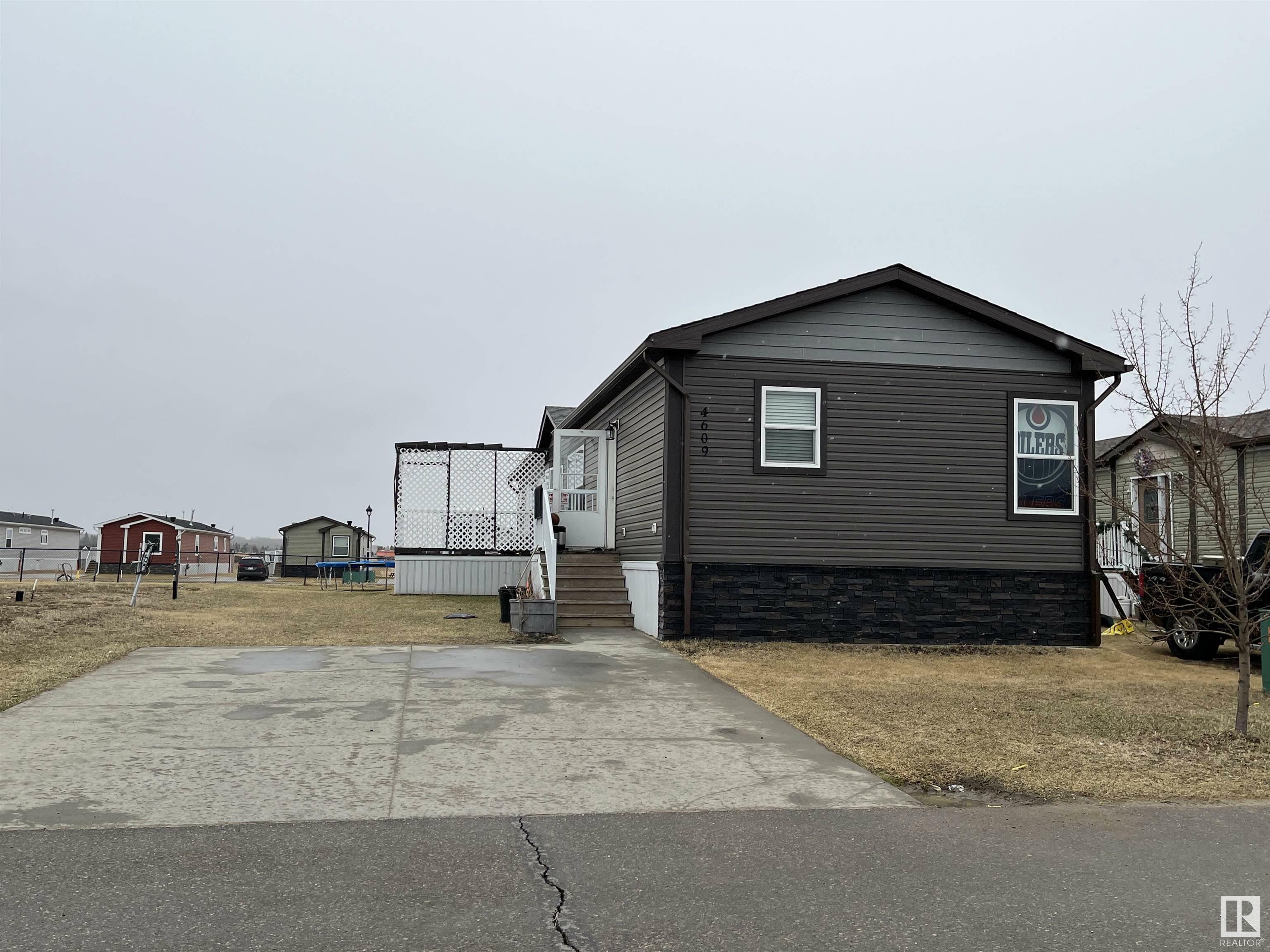 Property Photo:  4609 Snowbird Lane  AB T9M 0C6 