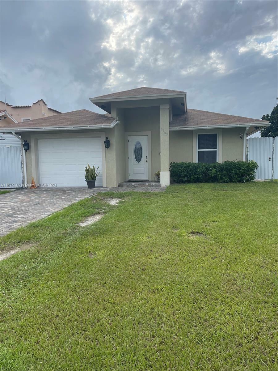 Property Photo:  1369 Rainbow Ave  FL 33406 