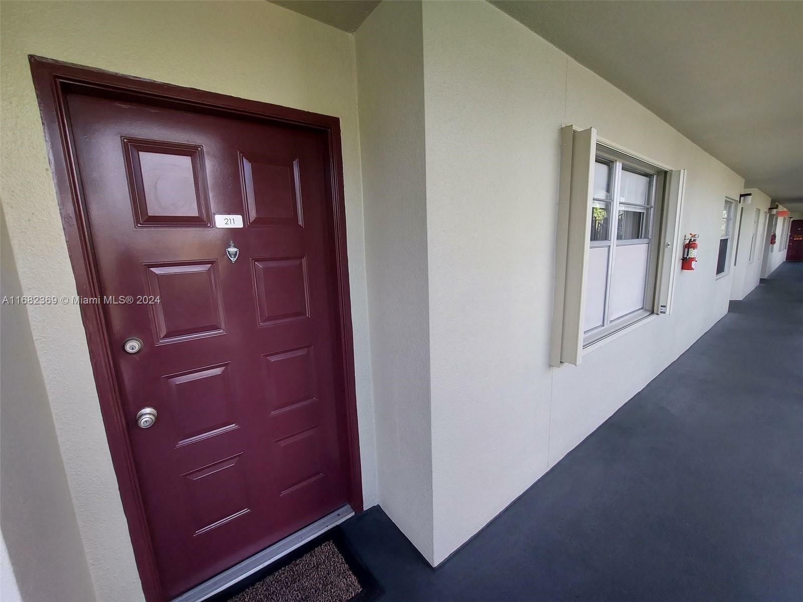 Property Photo:  12900 SW 13th St 211E  FL 33027 