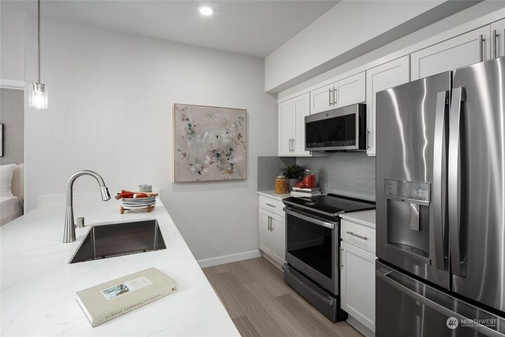 Property Photo: 1222 Confluence Way SE 202 WA 98045