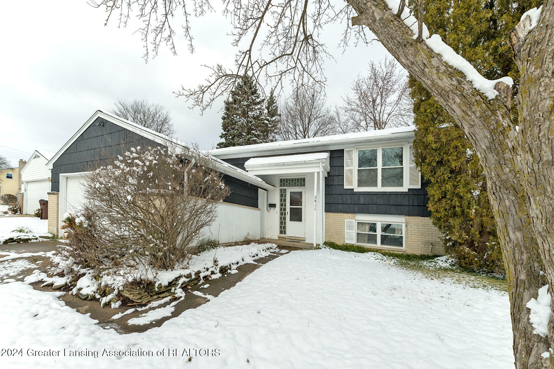 Property Photo:  2411 Lyman Drive  MI 48912 