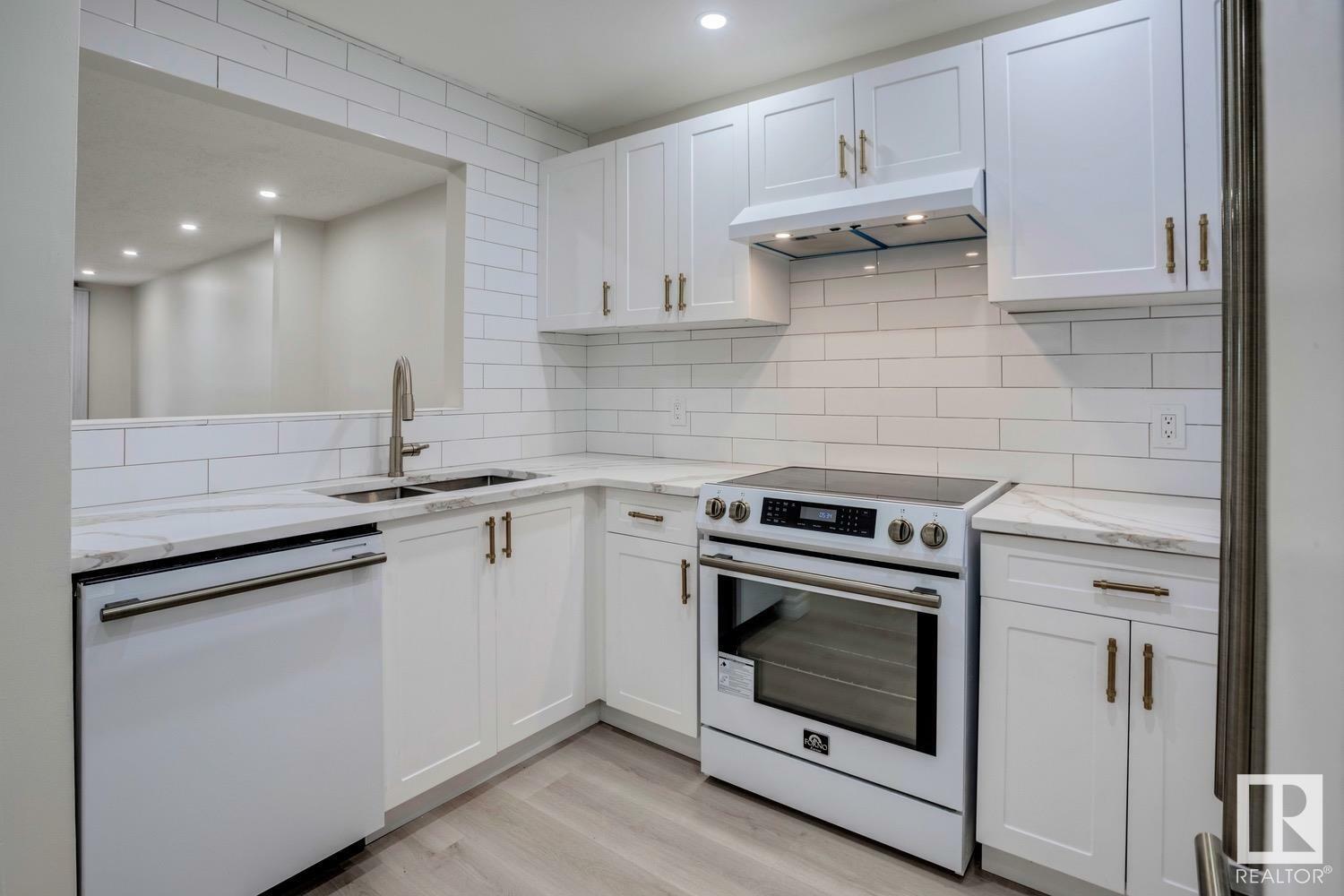 Property Photo:  14908 26 Street NW 303  AB T5Y 2G4 