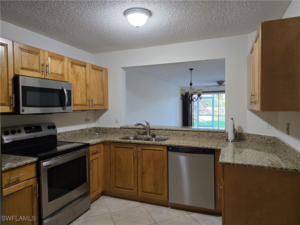 Property Photo:  5737 Whitaker Road C104  FL 34112 