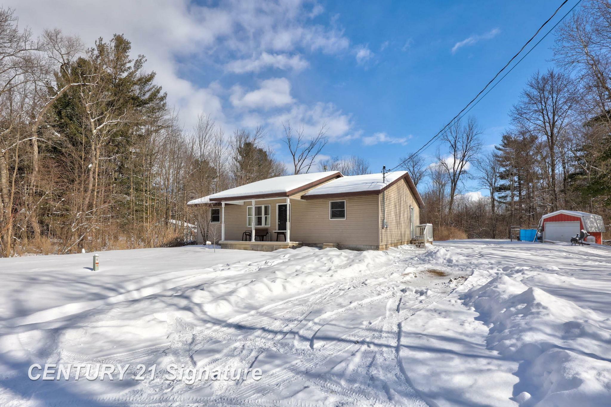 Property Photo:  4909 Caine Road  MI 48768 