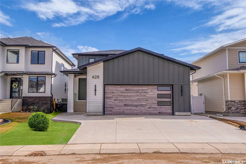 Property Photo: 428 Woolf Bend SK S7W 1E5