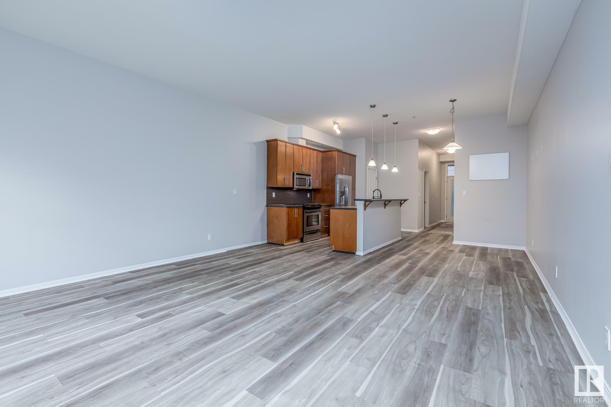 Property Photo: 10531 117 Street NW 220 AB T5H 3L7