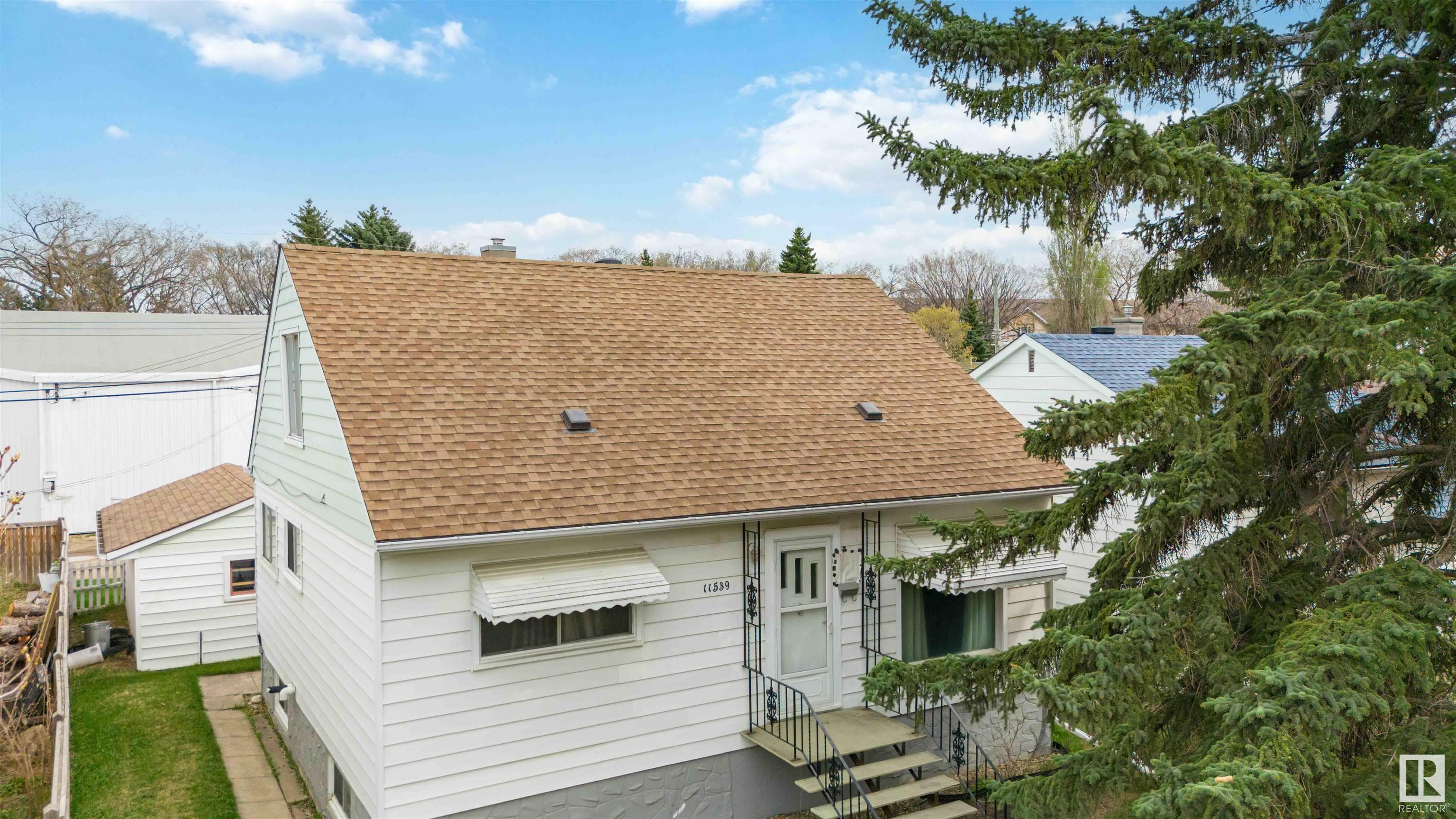 Property Photo: 11539 St Albert Trail NW AB T5M 3L4