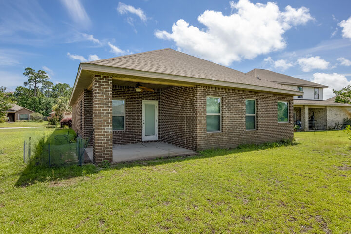 Property Photo:  897 Cocobolo Drive  FL 32459 