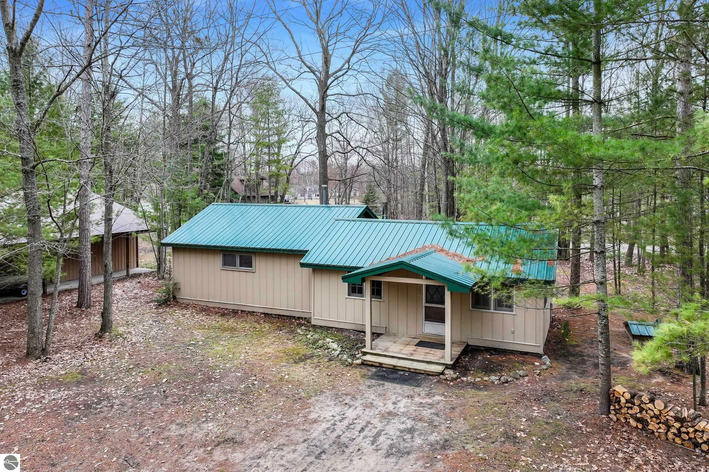 Property Photo: 1568 Poplar Drive, NE MI 49646