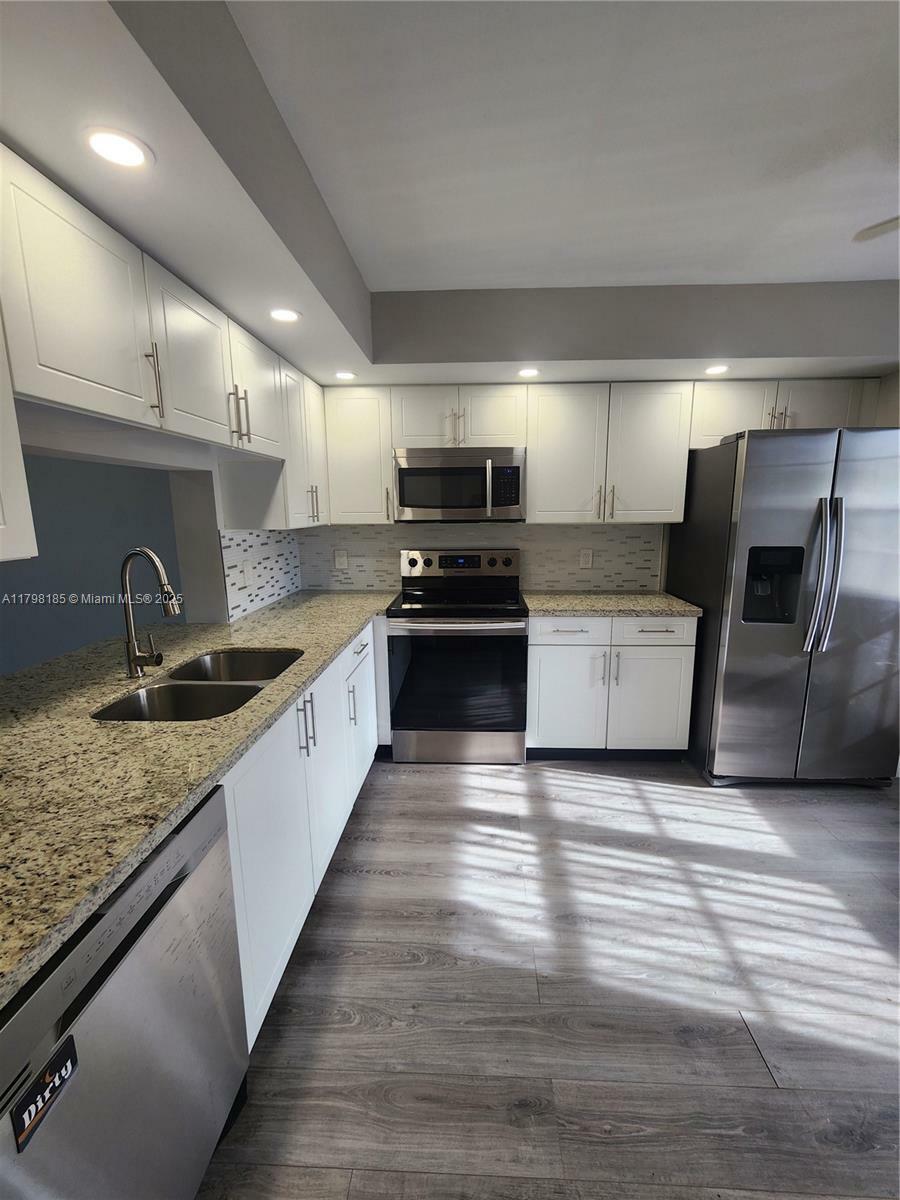 Property Photo:  1401 SW 128th Ter 305H  FL 33027 