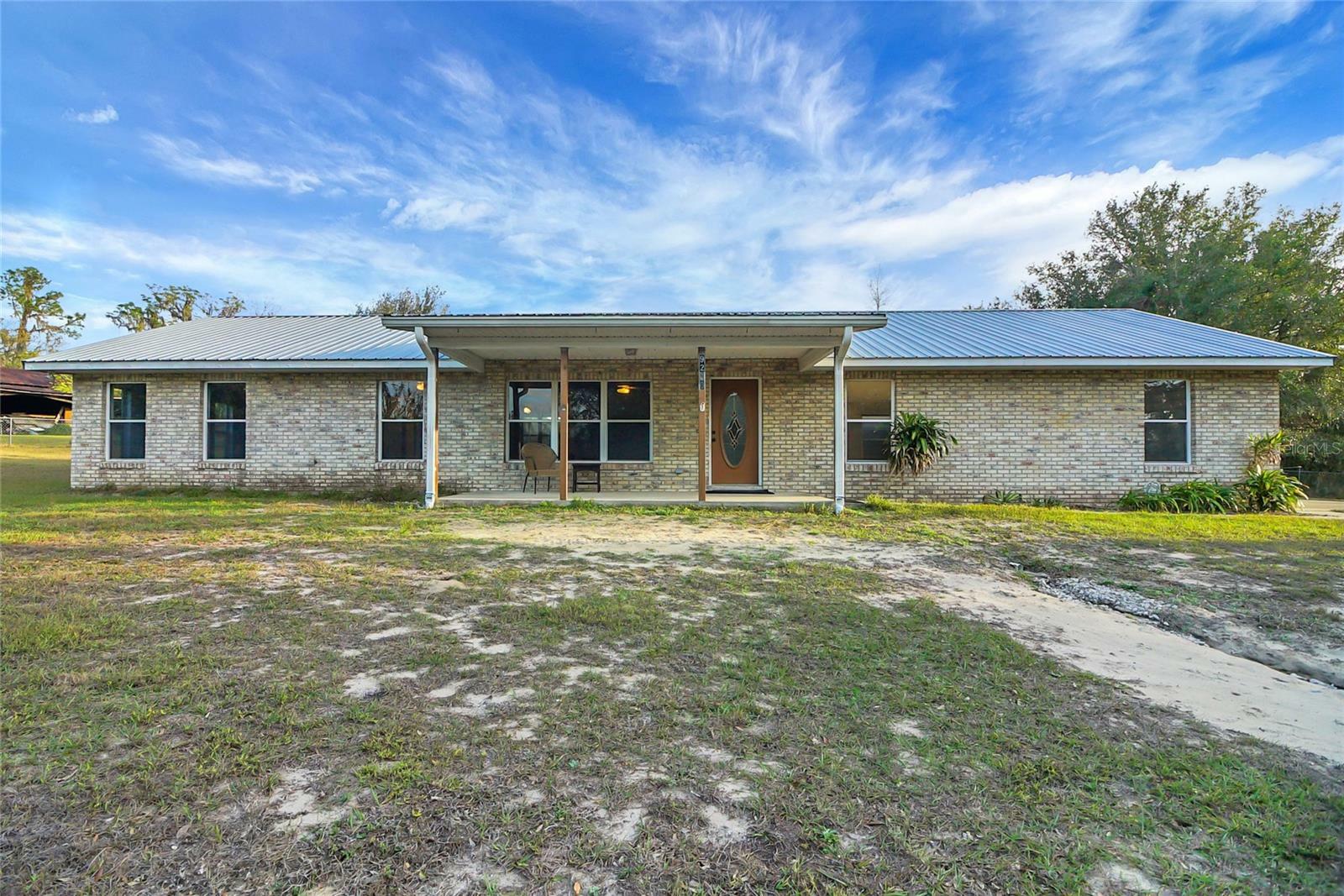 Property Photo: 9236 County Road 48 FL 34797