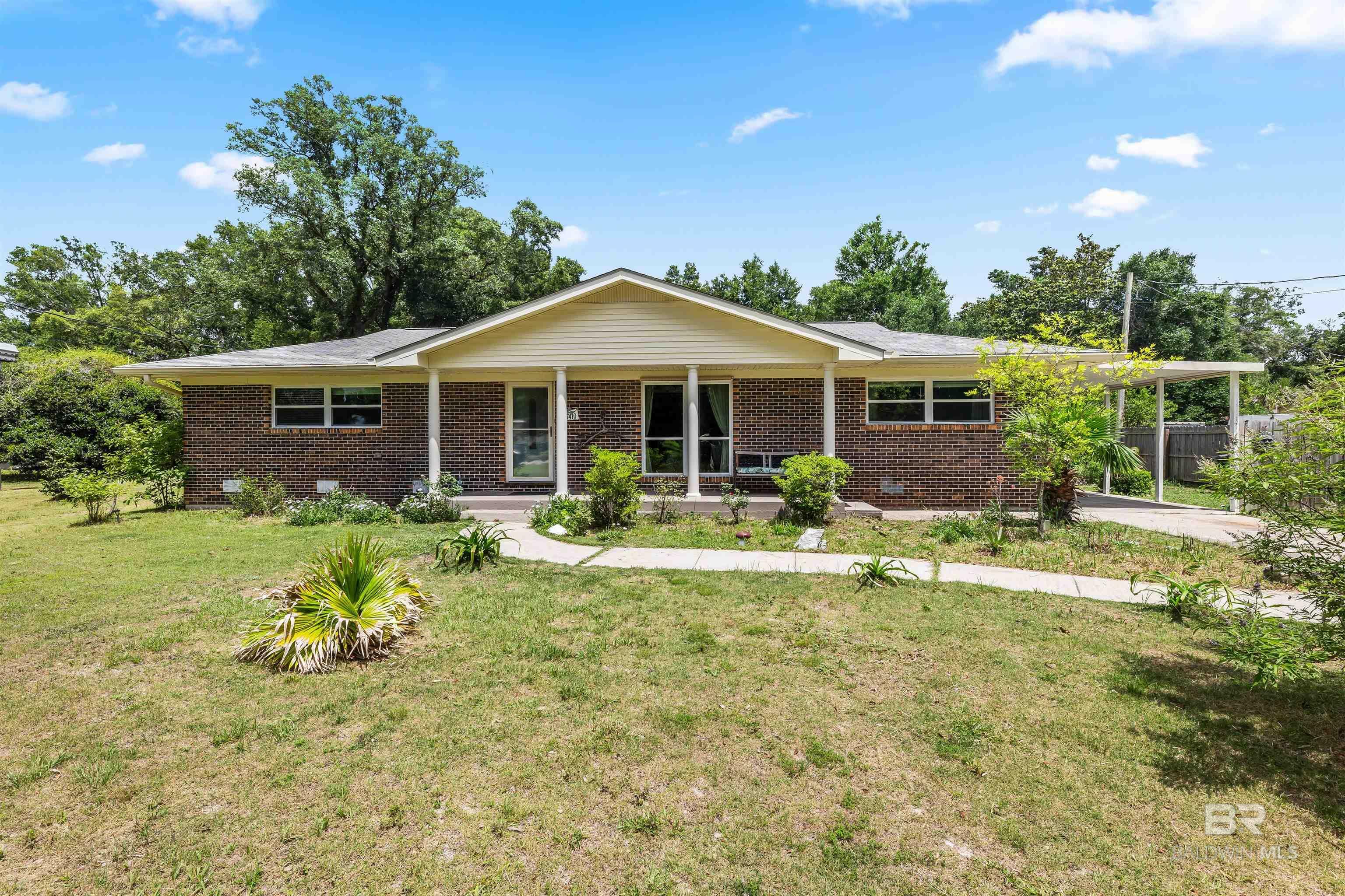 Property Photo: 7410 Helton Drive AL 36535