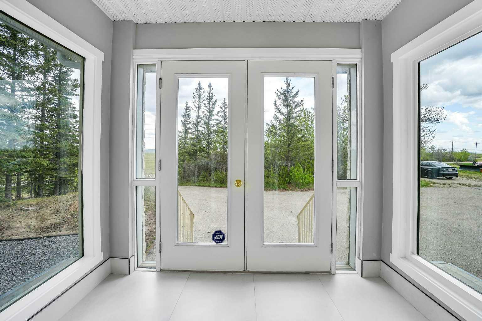 Property Photo: 24073 Burma Road AB T3R 1E3