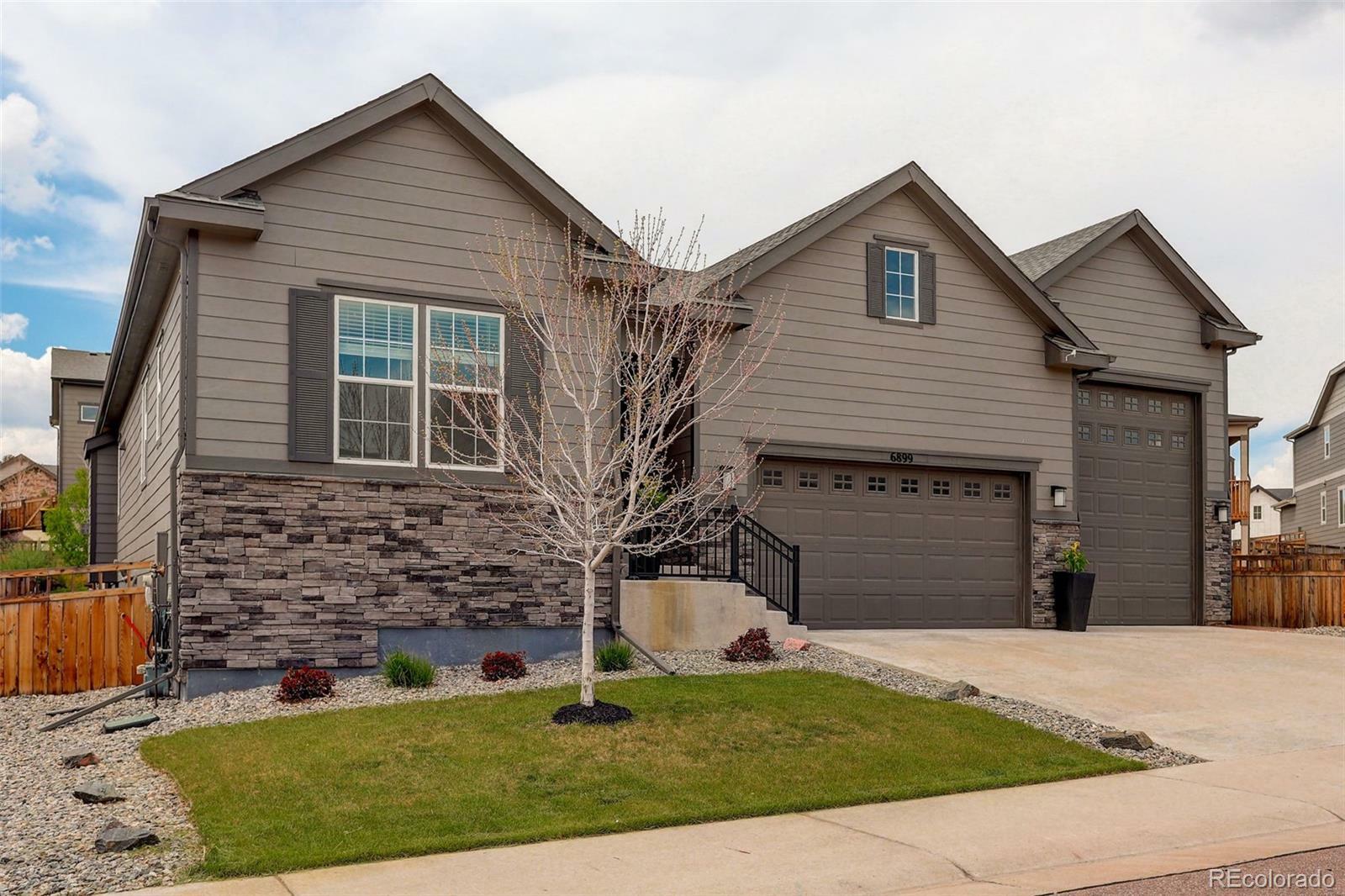 Property Photo: 6899 Petunia Place CO 80108