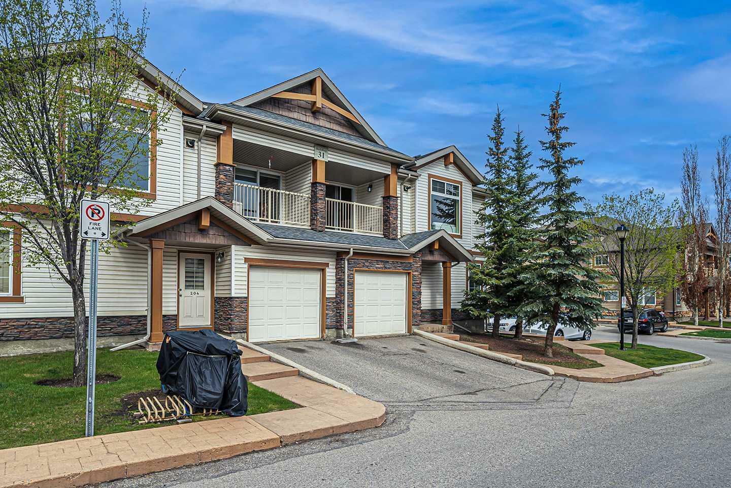 Property Photo: 31 Panatella Landing NW 202 AB T3K 0J7