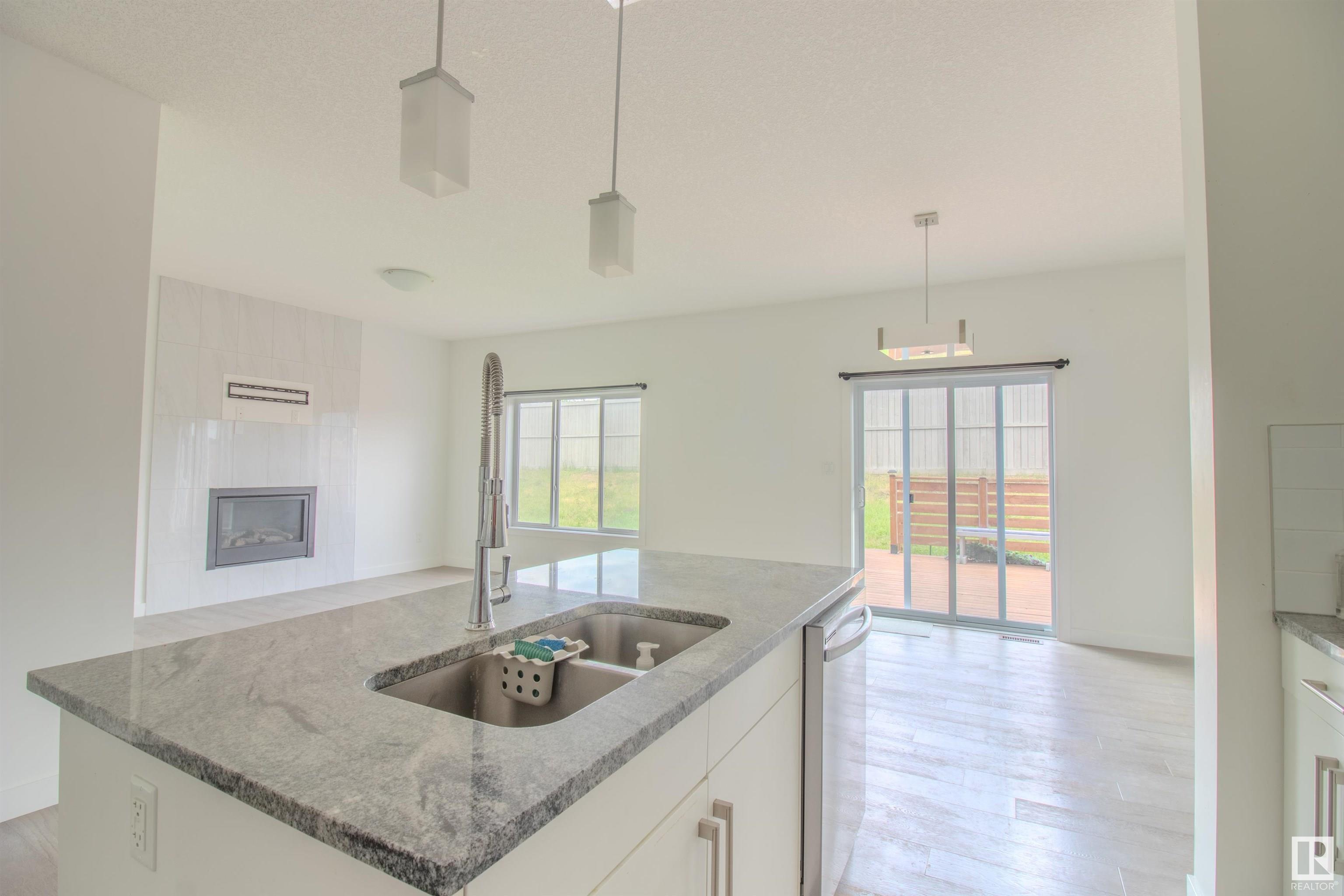 Property Photo: 1124 152 Avenue NW AB T5Y 0Z5