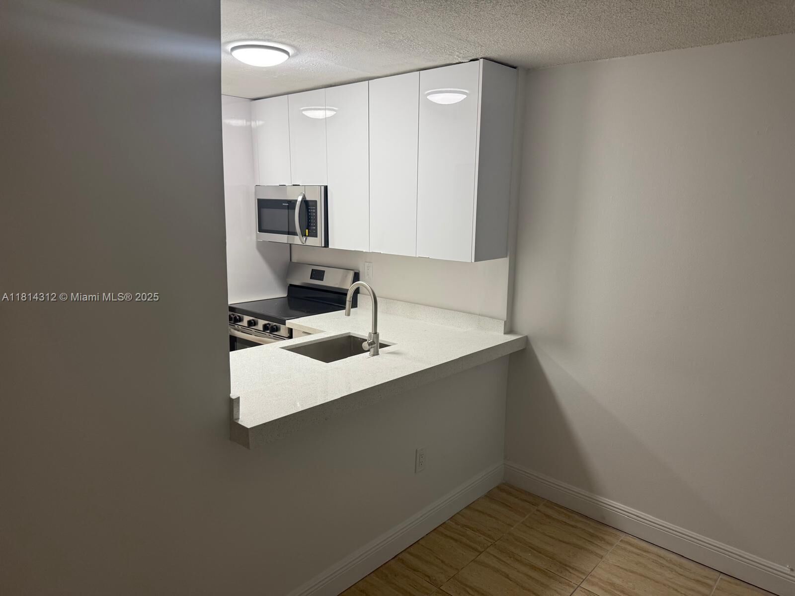 Property Photo:  496 NW 165th St Rd D-210  FL 33169 