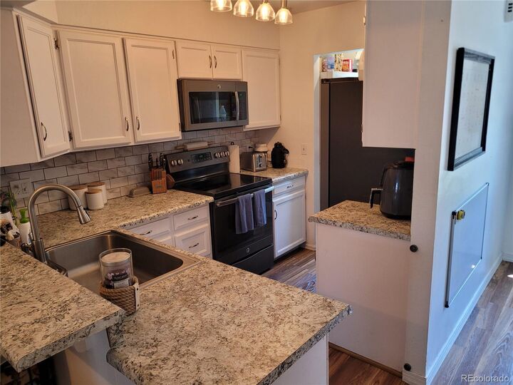 Property Photo:  15507 E Louisiana Avenue  CO 80017 