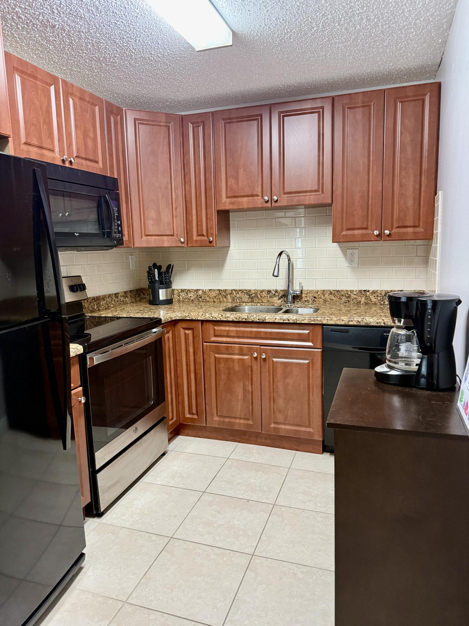 Property Photo:  405 Meadows Circle 405  FL 33436 