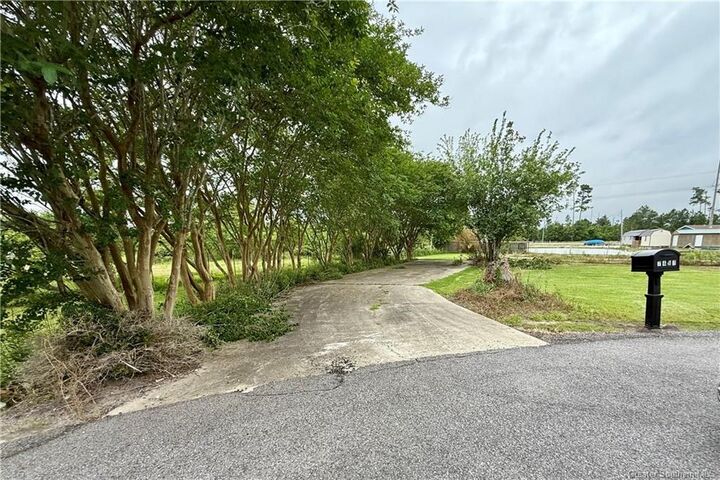 Property Photo:  7491 Pine Alley Lane  LA 70605 