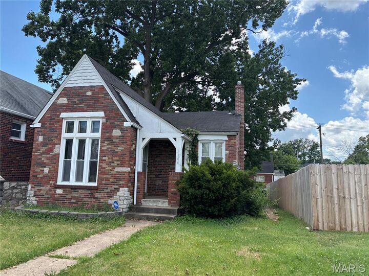 Property Photo:  6104 N Pointe Boulevard  MO 63147 