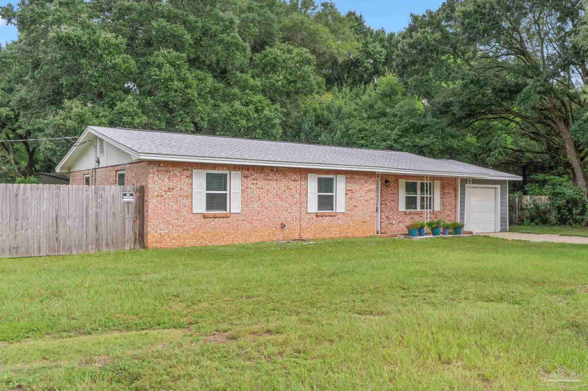Property Photo:  5600 Mulat Rd  FL 32583 