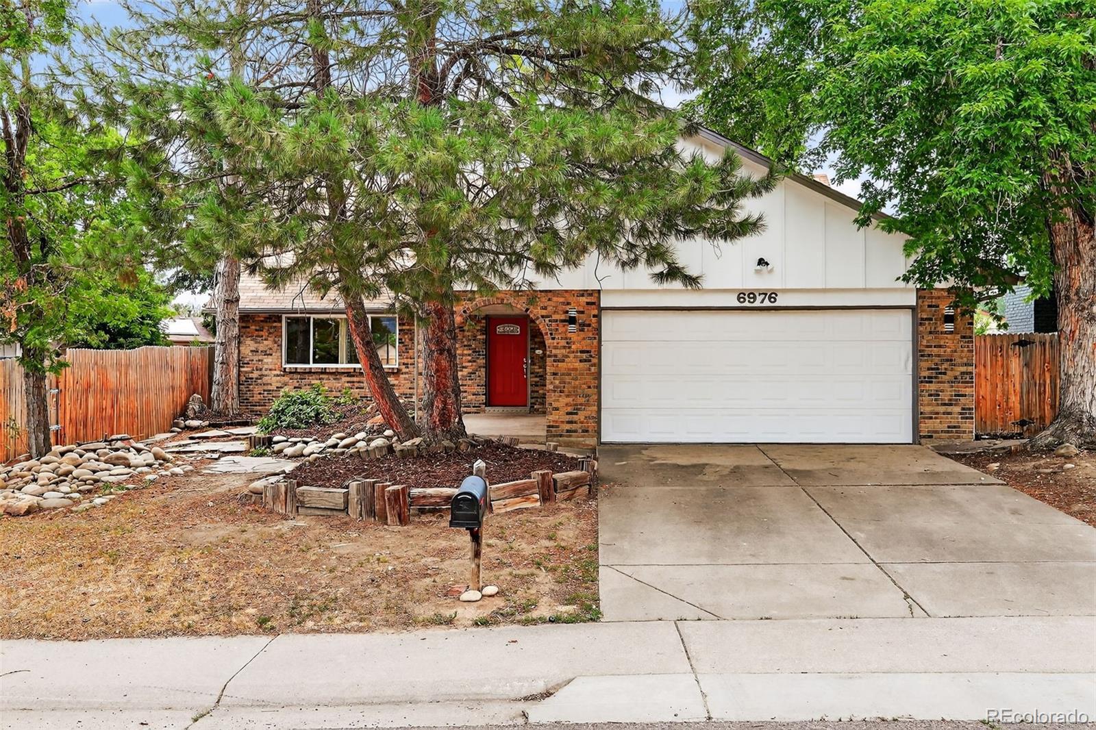 Property Photo: 6976 S Ammons Street CO 80128