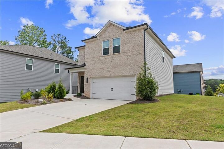 Property Photo:  10011 Deerhaven Parkway  GA 30291 
