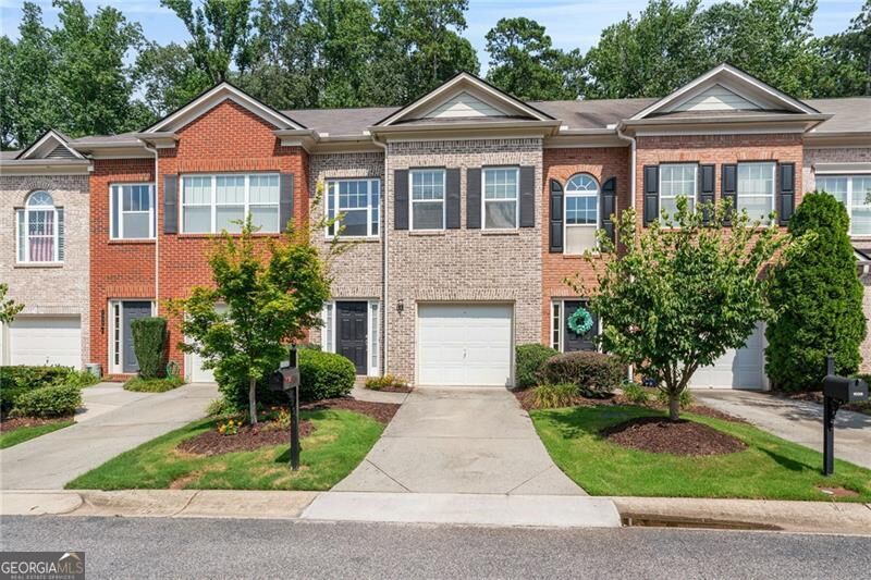 Property Photo:  1030 Firethorne Pass  GA 30040 
